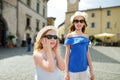 Two sisters exploring the famous Orvieto, a medieval hill town, rising above the almost-vertical faces of tuff cliffs and Royalty Free Stock Photo