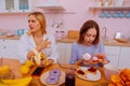 Two sisters having argument about healthy diet and harm of sugar