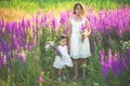 Two sisters holding hands in the flower chain