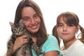 Two Sisters Holding Their Young Kitten Royalty Free Stock Photo