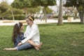 Two sisters looking at each other smiling. Royalty Free Stock Photo