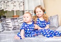 Two sisters. Older sister kid hugging his newborn little sister. Royalty Free Stock Photo