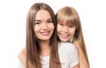 Two sisters - older and younger together. Portrait of beautiful young sisters teenage and adult girls hugging and smiling together Royalty Free Stock Photo