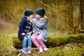 Two sisters picking the first flowers of spring Royalty Free Stock Photo