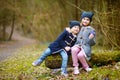 Two sisters picking the first flowers of spring Royalty Free Stock Photo