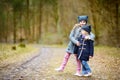 Two sisters picking the first flowers of spring Royalty Free Stock Photo