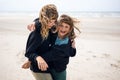 Two sisters playing on the beach Royalty Free Stock Photo