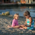 Two sisters playing on the beach Royalty Free Stock Photo