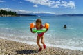 Two sisters playing games and swimming in the sea