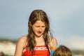 Two sisters playing games and swimming in the sea