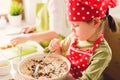 Two sisters preparing granola together.