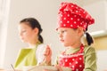 Two sisters preparing granola together.