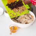 Two sisters preparing granola together