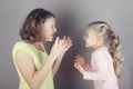 Two sisters quarrel, argue and wave their arms