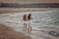 Two sisters on the shore of the sea