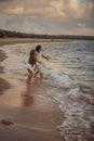 Two sisters on the shore of the sea