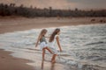 Two sisters on the shore of the sea