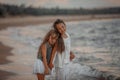Two sisters  on the shore of the sea Royalty Free Stock Photo