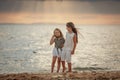 Two sisters on the shore of the sea