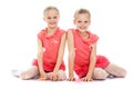 Two sisters sit on the floor Royalty Free Stock Photo