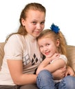 Two sisters sitting together Royalty Free Stock Photo