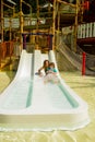 Young girls in the water slides of a park or a resort Royalty Free Stock Photo