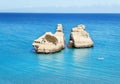 The Two Sisters stacks in front of the shore of Torre dell`Orso Royalty Free Stock Photo