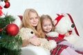 Two sisters with teddy bears. Winter holidays.