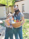 Two sisters, teenager volunteers with food packages for the poor during a pandemic coronavirus.