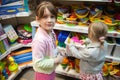 Two sisters in toy store Royalty Free Stock Photo