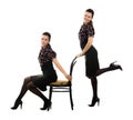 Two sisters, twins with a chair in retro style Royalty Free Stock Photo
