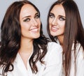 Two sisters twins posing, making photo selfie Royalty Free Stock Photo