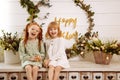 Two sisters in white dresses at a birthday party Royalty Free Stock Photo