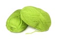 Two skeins of green wool yarn.