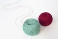 two skeins of multicolored wool yarn on an isolated white background