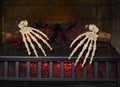 Two skeleton hands in fireplace Royalty Free Stock Photo