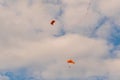 Two skydivers flying with parachute against cloudy sky - extreme sport concept Royalty Free Stock Photo