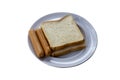 Two Slice of bread and 2 sausage filling in a white plate on a white background with clipping path