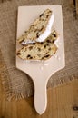 Two slice christmas stollen on a wooden board