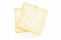 Two sliced whole wheat bread on glass plate on white background