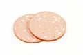 Two slices of chicken mortadella isolated on white background Royalty Free Stock Photo