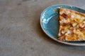 Two slices of delicious pizza on a designer loft-style porcelain plate