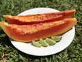 Two slices of fresh papaya with lime Royalty Free Stock Photo