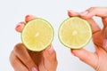 Two slices of lime in human hand Royalty Free Stock Photo