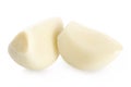 For two slices. Peeled garlic on white isolate background with shadow.