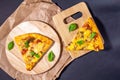 Two slices of pizza with Basil on a wooden Board. top view flat lay Royalty Free Stock Photo