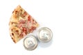 Two slices of pizza and two cans of beer on a white background with copy space Royalty Free Stock Photo