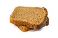 Two slices of rye bread on a white background. Delicious, brown bread. Close-up. Royalty Free Stock Photo