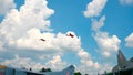 Two small airplanes flying thorough the sky