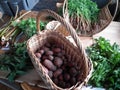 Two baskets with mini crop of vegetables.